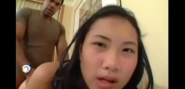  Young Thai girl Nat gets pumped full of African semen